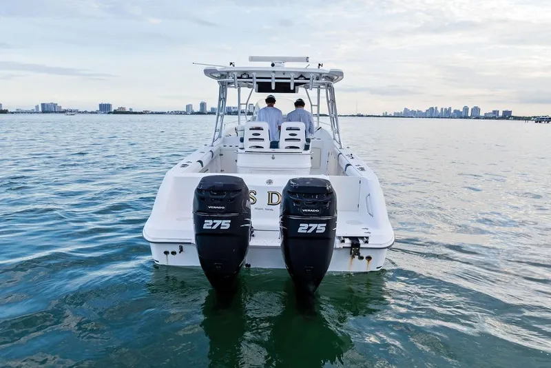 Slide: The Image of 2005 Boston Whaler 320 Outrage Cuddy Cabin on water, twin 275 Verado engines. - 10