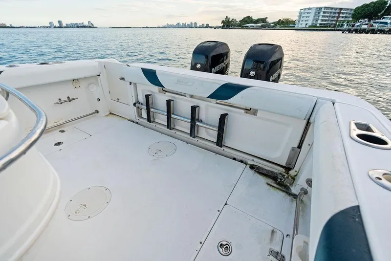 Slide: The Image of 2005 Boston Whaler 320 Outrage Cuddy Cabin boat interior with dual Mercury engines. - 19
