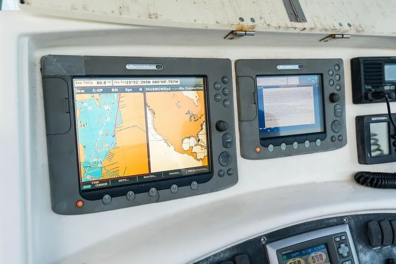 Slide: The Image of Navigation system on 2005 Boston Whaler 320 Outrage Cuddy Cabin boat dashboard. - 24