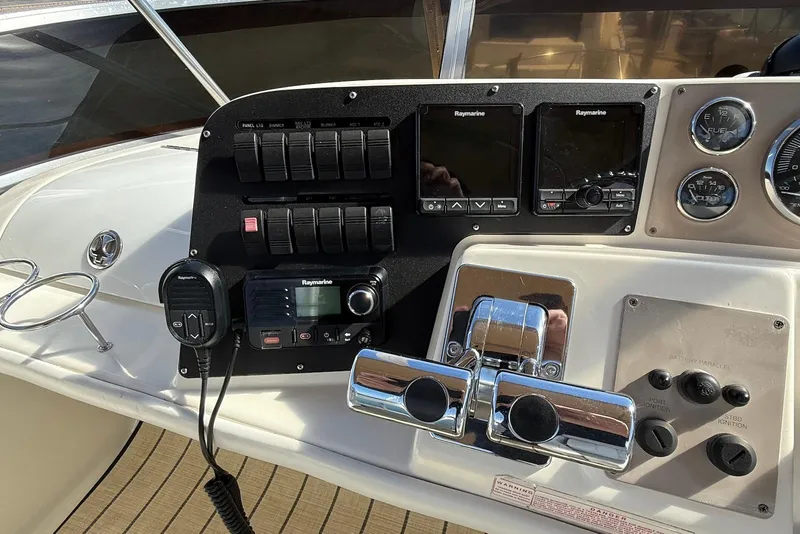 Slide: The Image of Control panel of a 2003 Regal Commodore 3880 boat with navigation equipment. - 11