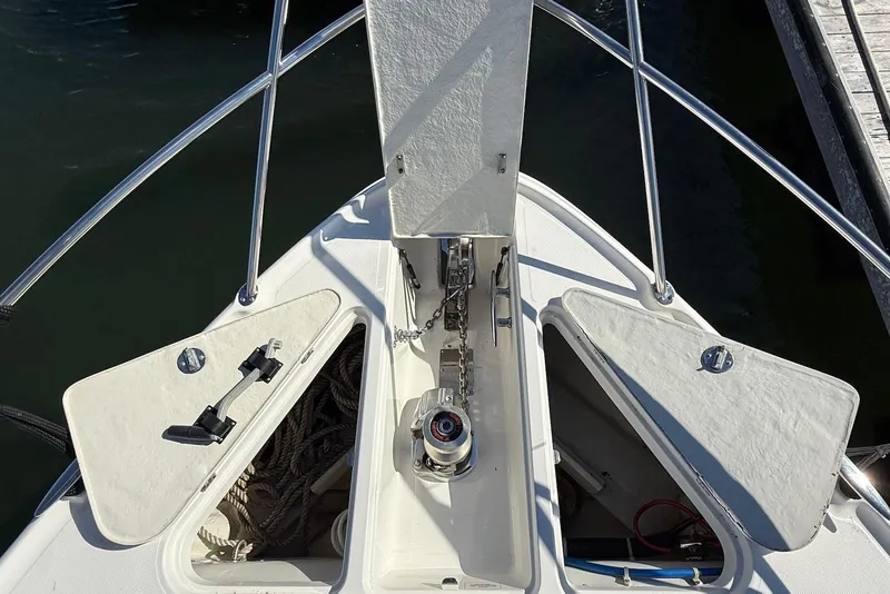 Slide: The Image of Bow of 2003 Regal Commodore 3880 with anchor storage compartments open. - 16