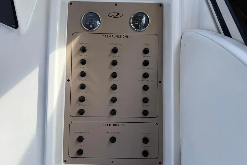 Slide: The Image of Control panel of a 2003 Regal Commodore 3880 boat with various dash functions. - 28