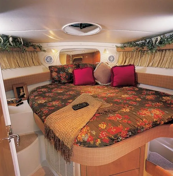 Slide: The Image of 2003 Regal Commodore 3880 yacht docked at marina, rear view. - 3