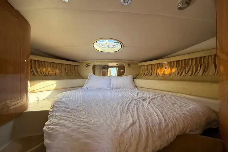 Slide: The Image of Luxurious bedroom interior of 2003 Regal Commodore 3880 yacht with cozy bedding. - 33