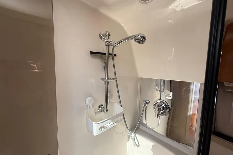 Slide: The Image of Shower area in 2003 Regal Commodore 3880 yacht, featuring chrome fixtures and a sleek design. - 39