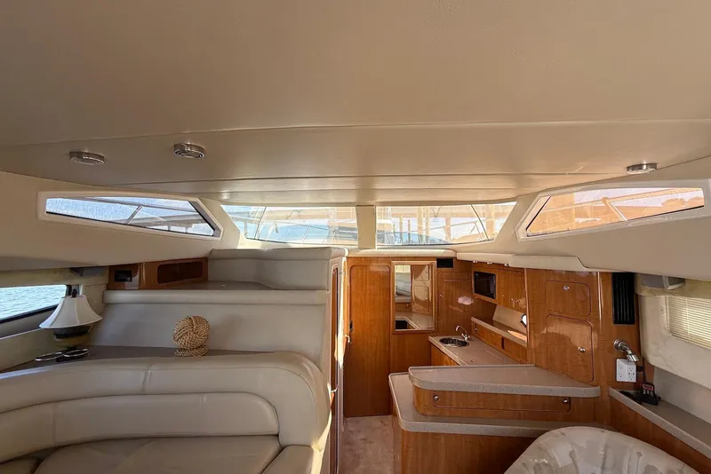 Slide: The Image of Interior of 2003 Regal Commodore 3880 yacht with elegant wood finish and modern amenities. - 40