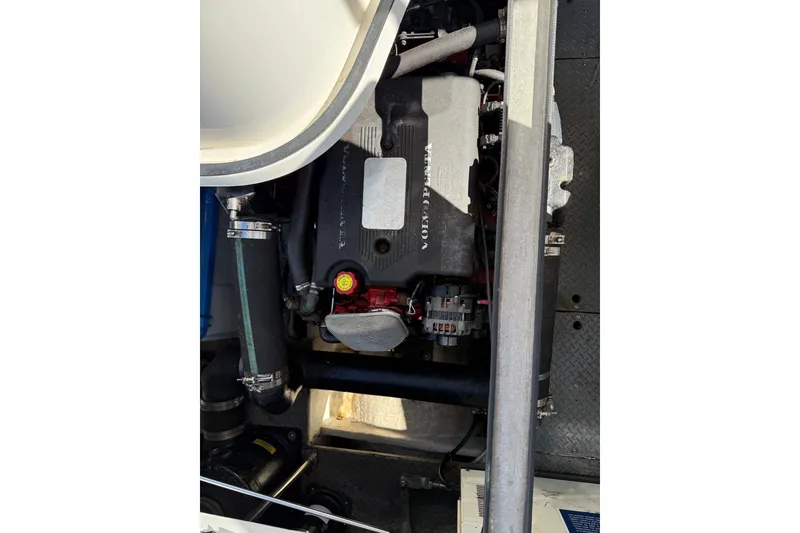 Slide: The Image of Engine compartment of a 2003 Regal Commodore 3880 boat, featuring a Volvo Penta engine. - 52