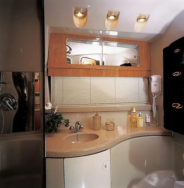 Slide: The Image of Helm of 2003 Regal Commodore 3880 yacht with steering wheel and navigation controls. - 6