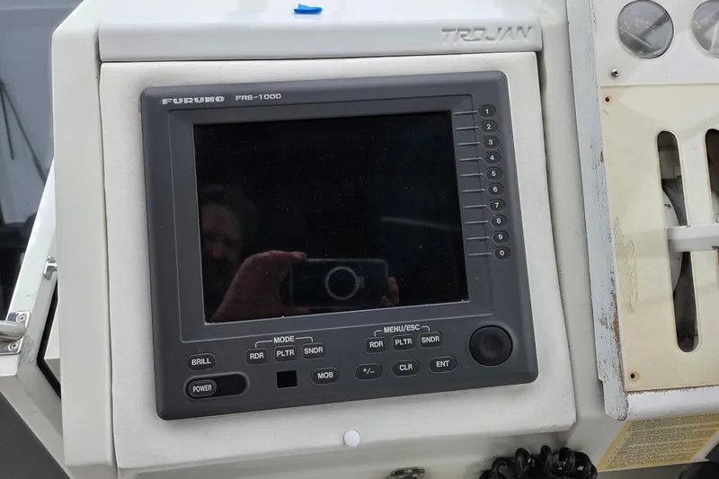 Slide: The Image of Control panel of a 1990 Trojan 10 Meter Express 330 boat with Furuno FRB-1000 display. - 15