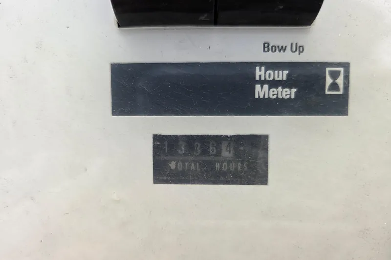 Slide: The Image of Hour meter display on 1990 Trojan 10 Meter Express 330, showing total hours. - 16