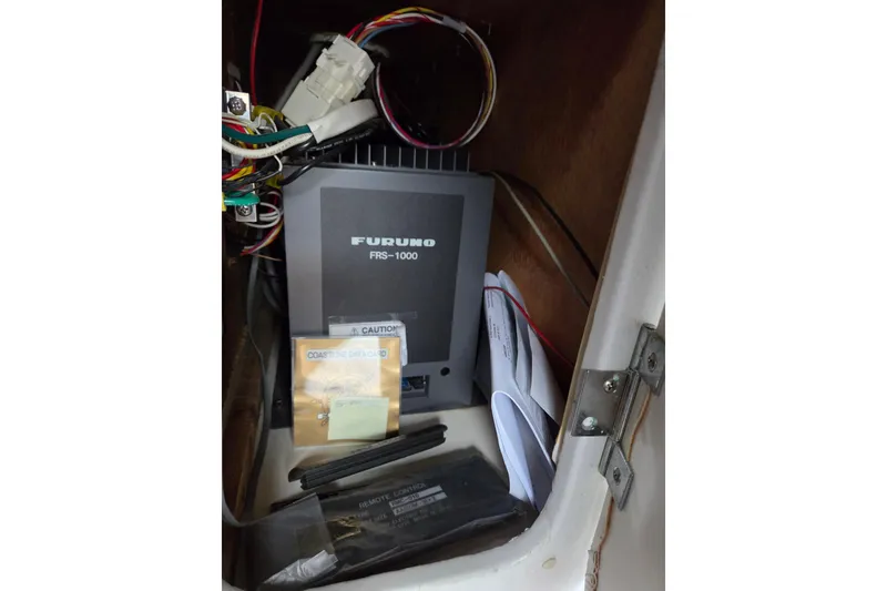 Slide: The Image of Electrical compartment of 1990 Trojan 10 Meter Express 330 with Furuno FRS-1000 equipment. - 36