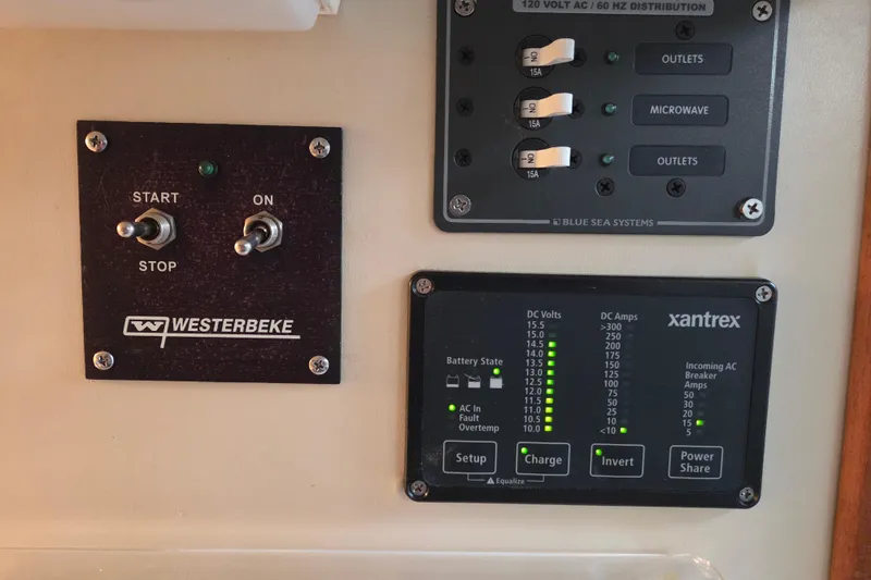 Slide: The Image of Control panel of a 1990 Trojan 10 Meter Express 330 with Westerbeke and Xantrex systems. - 31
