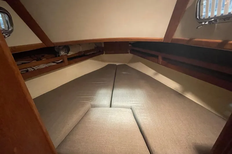Slide: The Image of Cozy cabin interior of 1997 Pacific Seacraft 34 sailboat with cushioned V-berth. - 26