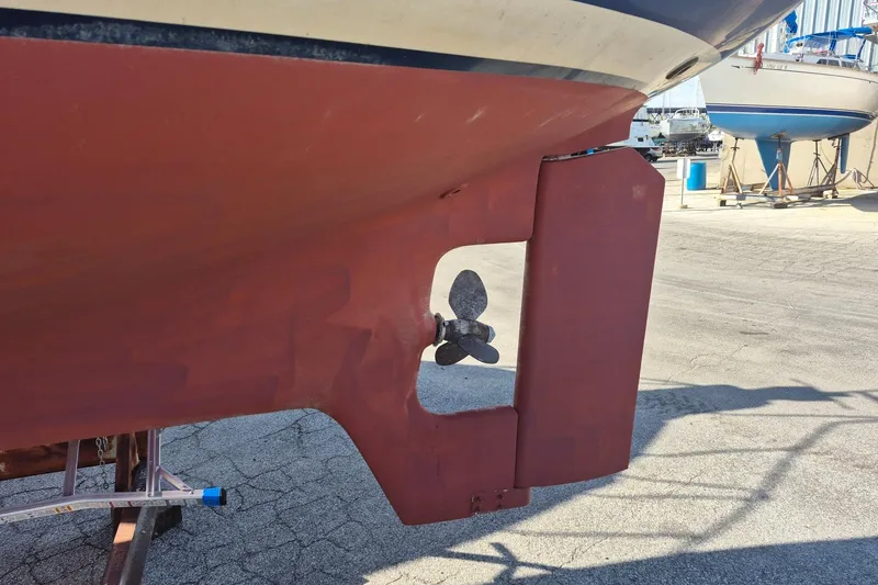 Slide: The Image of 1997 Pacific Seacraft 34 sailboat hull and propeller in dry dock. - 5