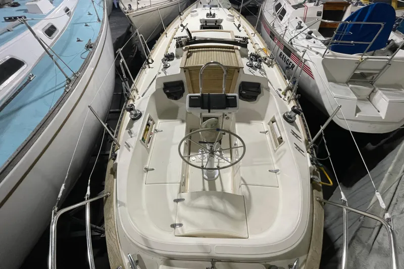 Slide: The Image of 1997 Pacific Seacraft 34 sailboat docked among other vessels, top view. - 8