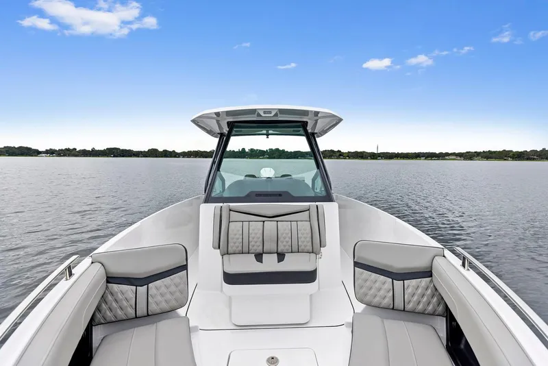 Slide: The Image of 2026 Monterey Elite 27 SD boat on trailer under clear blue sky. - 2