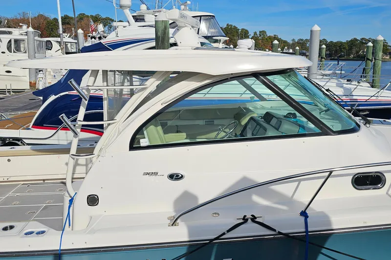 Slide: The Image of 2016 Pursuit OS 385 Offshore boat docked at marina. - 20