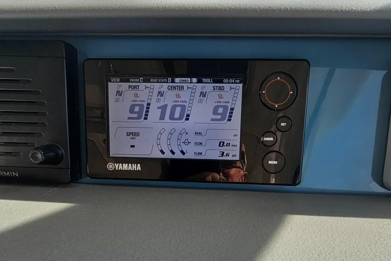 Slide: The Image of Yamaha display on 2016 Pursuit OS 385 Offshore boat dashboard showing engine data. - 23