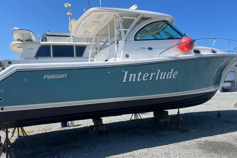 Slide: The Image of 2016 Pursuit OS 385 Offshore boat named "Interlude" on dry dock. - 27