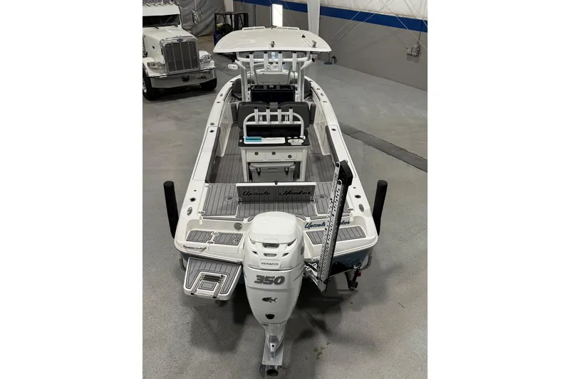 Slide: The Image of 2022 Crevalle 26 HCO boat with powerful 350 Verado engine in a showroom. - 4