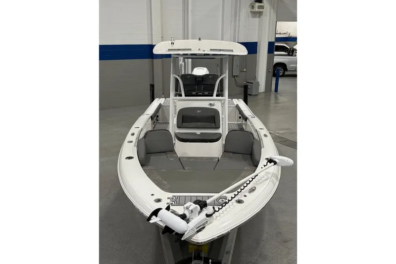 Slide: The Image of 2022 Crevalle 26 HCO boat in showroom, featuring sleek design and modern amenities. - 5