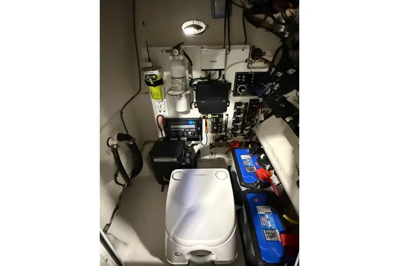 Slide: The Image of 2022 Crevalle 26 HCO boat interior with equipment and batteries. - 7