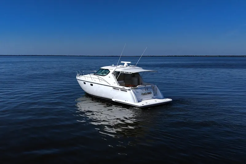 Slide: The Image of 2008 Tiara Yachts 4300 Sovran cruising on calm blue waters. - 10