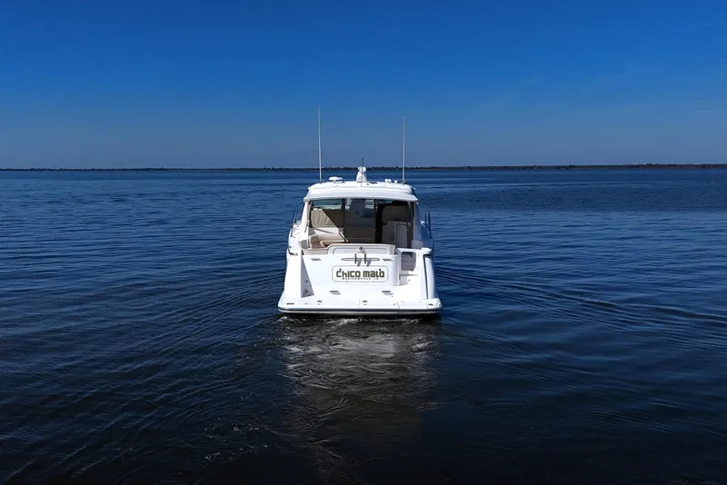 Slide: The Image of 2008 Tiara Yachts 4300 Sovran cruising on calm blue waters. - 11