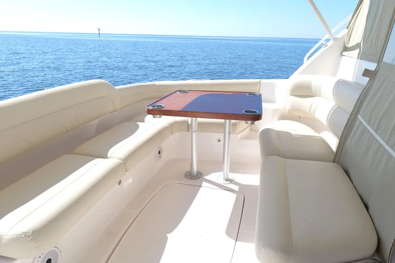 Slide: The Image of 2008 Tiara Yachts 4300 Sovran swim platform with rod holders, overlooking sparkling water. - 14