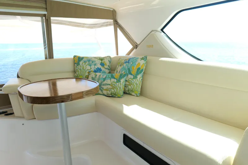 Slide: The Image of Luxurious interior of 2008 Tiara Yachts 4300 Sovran with plush seating and decorative pillows. - 18