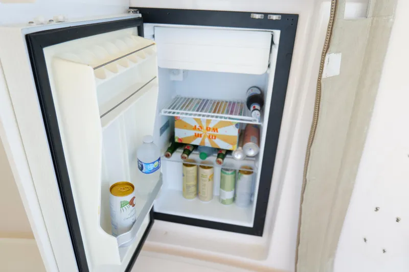 Slide: The Image of 2008 Tiara Yachts 4300 Sovran interior with built-in storage and cup holders. - 20