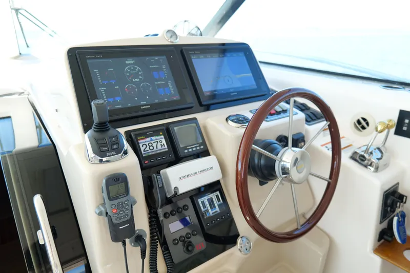 Slide: The Image of Luxurious 2008 Tiara Yachts 4300 Sovran interior with plush seating and decorative pillow. - 23