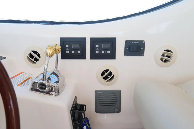 Slide: The Image of Helm of 2008 Tiara Yachts 4300 Sovran with navigation screens and controls. - 25