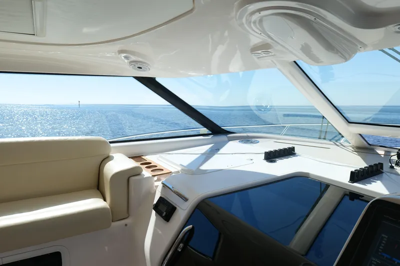 Slide: The Image of Control panel of a 2008 Tiara Yachts 4300 Sovran with throttle and air vents. - 26