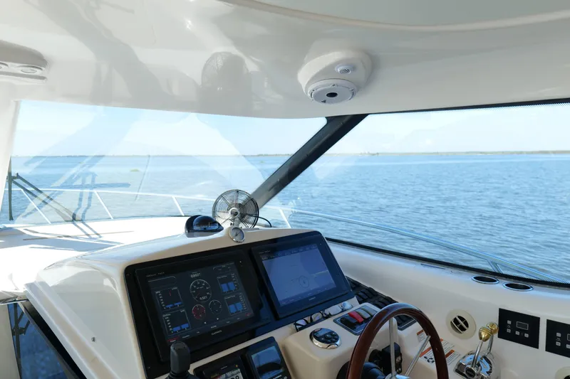 Slide: The Image of Helm of 2008 Tiara Yachts 4300 Sovran with ocean view and navigation equipment. - 28