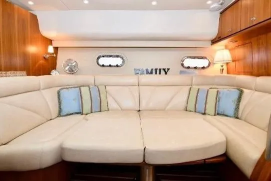 Slide: The Image of Luxurious interior of 2008 Tiara Yachts 4300 Sovran with elegant seating and wooden table. - 32