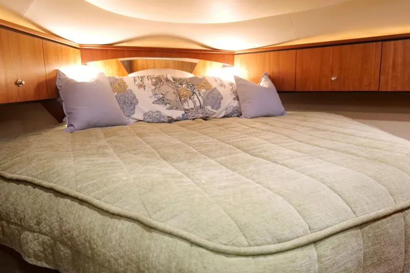 Slide: The Image of Luxurious cabin interior of 2008 Tiara Yachts 4300 Sovran with cozy bedding. - 41