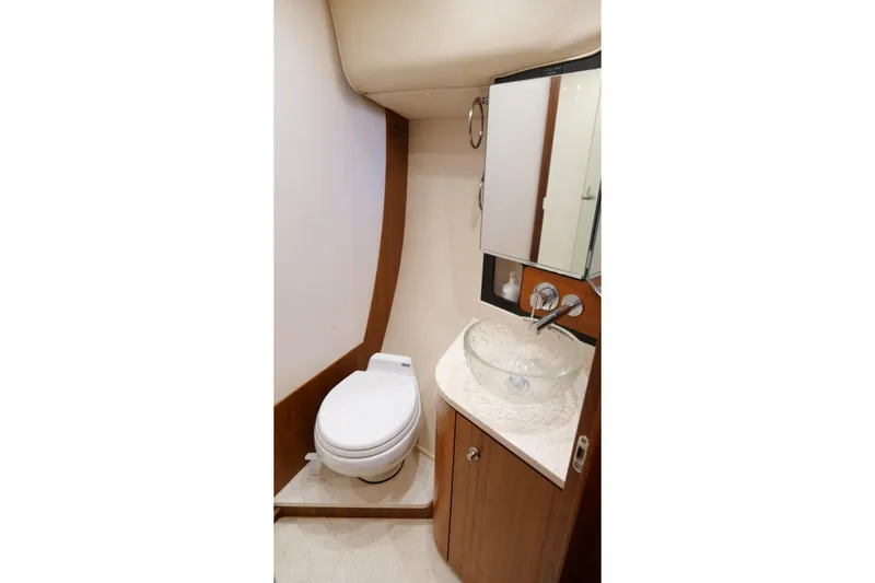 Slide: The Image of Luxurious bedroom interior of 2008 Tiara Yachts 4300 Sovran with cozy bedding and ambient lighting. - 42
