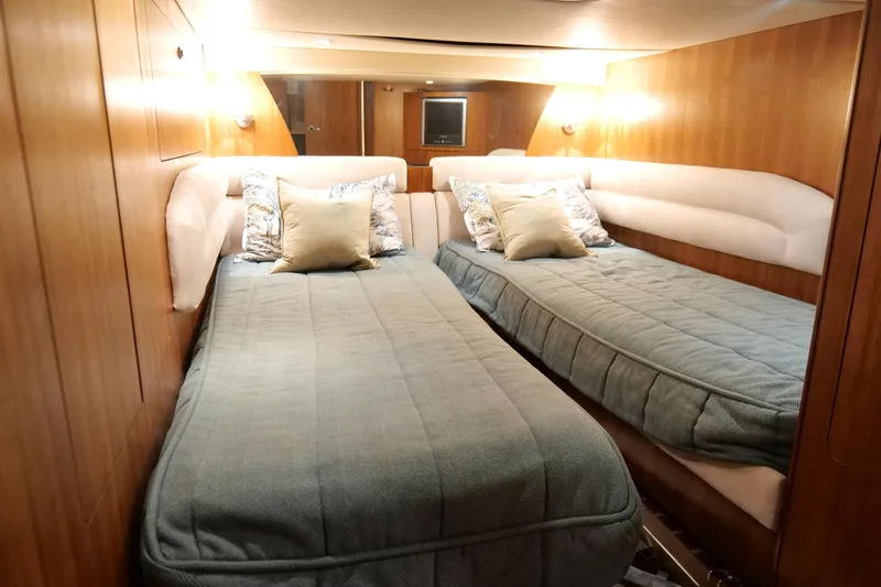 Slide: The Image of 2008 Tiara Yachts 4300 Sovran closet with hangers, fire extinguisher, and fan. - 45