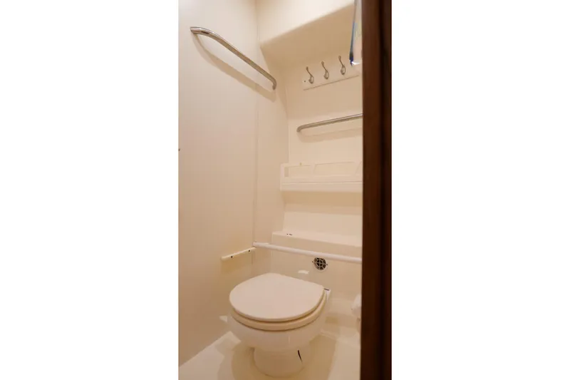 Slide: The Image of 2008 Tiara Yachts 4300 Sovran cabin with twin beds and elegant wood paneling. - 46