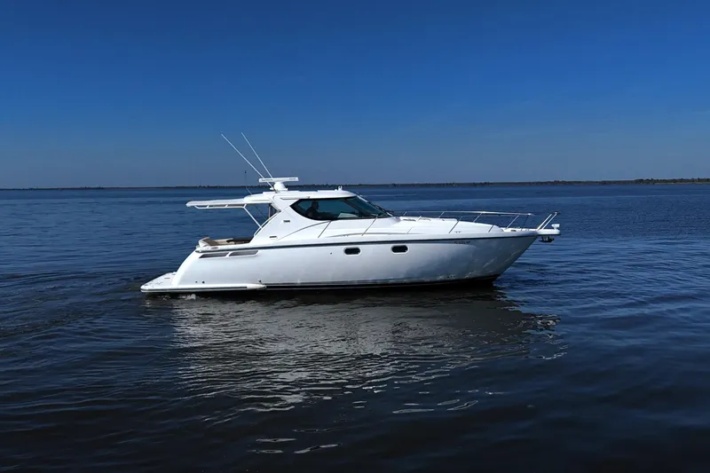 Slide: The Image of 2008 Tiara Yachts 4300 Sovran cruising on calm blue waters. - 5