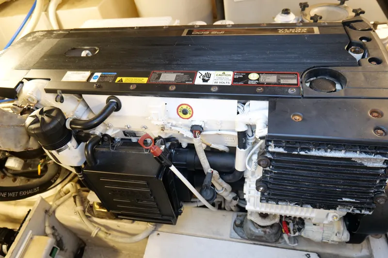 Slide: The Image of Engine compartment of a 2008 Tiara Yachts 4300 Sovran, showcasing detailed mechanical components. - 56