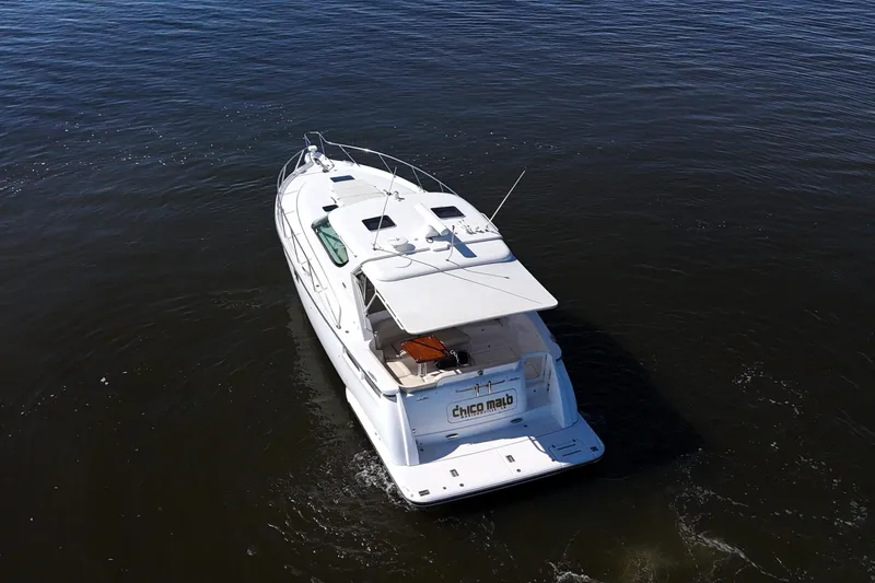 Slide: The Image of 2008 Tiara Yachts 4300 Sovran cruising on calm waters, aerial view. - 62