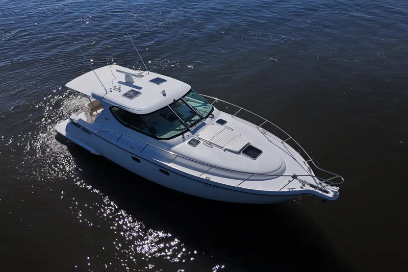 Slide: The Image of 2008 Tiara Yachts 4300 Sovran cruising on calm waters, aerial view. - 63