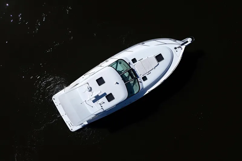 Slide: The Image of Aerial view of 2008 Tiara Yachts 4300 Sovran cruising on dark water. - 64