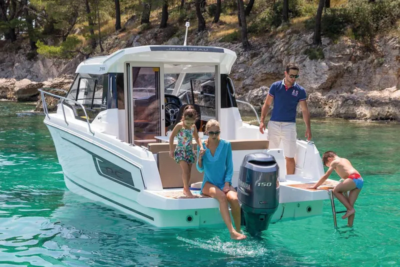 Slide: The Image of Cockpit of 2020 Jeanneau NC 795 boat with steering wheel and control panel. - 10