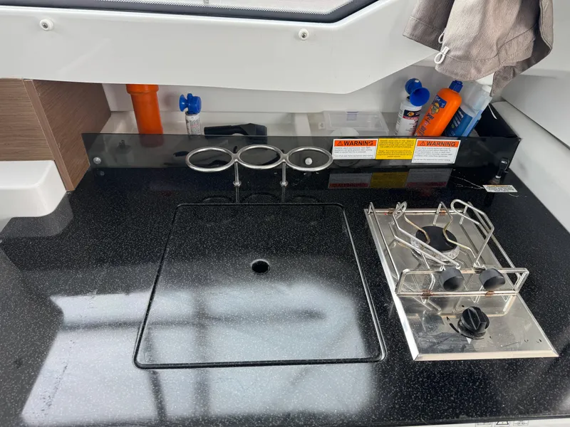 Slide: The Image of 2020 Jeanneau NC 795 boat windshield and deck view at marina. - 26