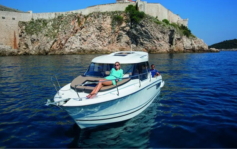 Slide: The Image of 2020 Jeanneau NC 795 dashboard with Garmin navigation system and Yamaha controls. - 9