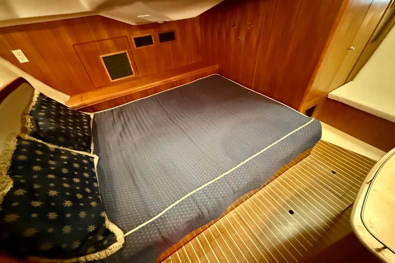 Slide: The Image of Luxurious cabin interior of 2003 Hunter 426 Deck Salon yacht with cozy bedding. - 16