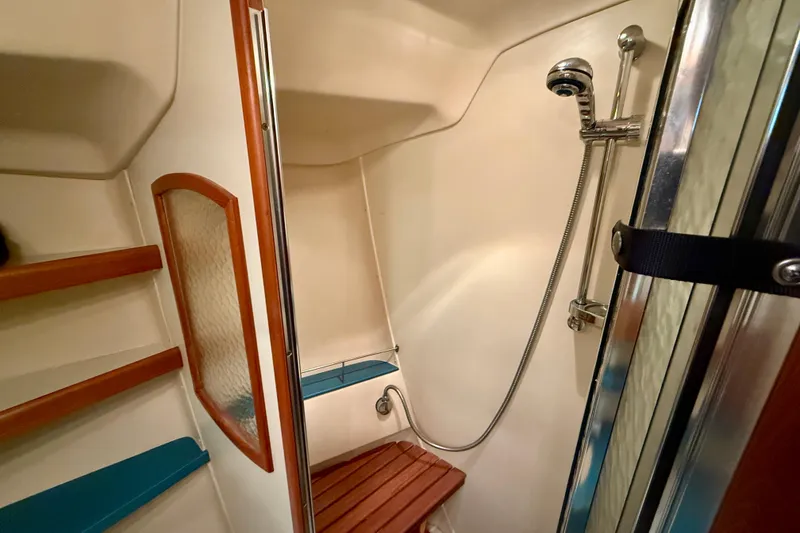Slide: The Image of Shower area in 2003 Hunter 426 Deck Salon yacht with wooden accents and modern fixtures. - 23